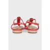 Red sandals with metallic decor