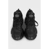 Black leather sneakers with shiny inserts