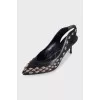 Black slingbacks with metallic decor