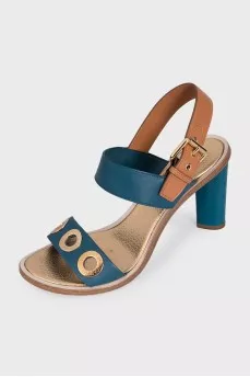 Leather sandals with a gold eyelet