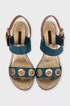 Leather sandals with a gold eyelet