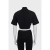 Black top with embroidery on the collar