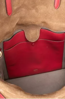 Leather bag with a belt in a signature print