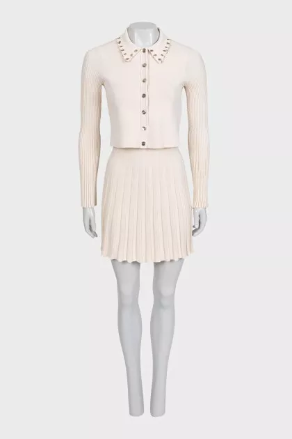 Suit with a beige jacket and skirt