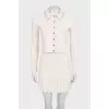 Suit with a beige jacket and skirt