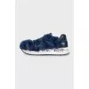 Blue sneakers decorated with fur