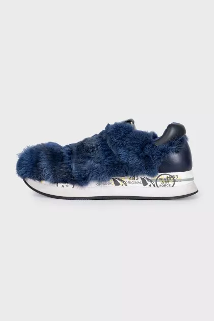 Blue sneakers decorated with fur
