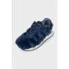 Blue sneakers decorated with fur