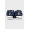 Blue sneakers decorated with fur