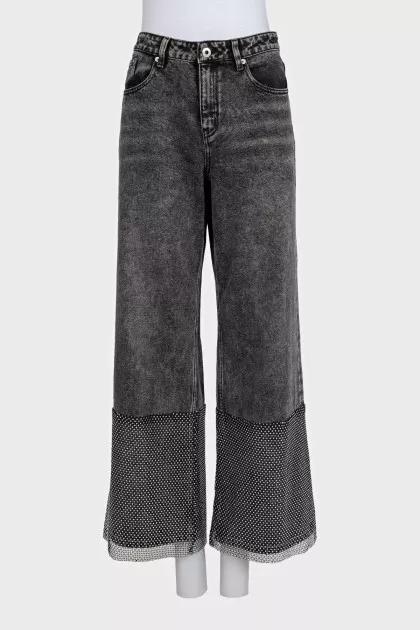 Black jeans decorated with rhinestones
