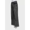 Black jeans decorated with rhinestones