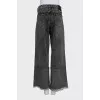 Black jeans decorated with rhinestones