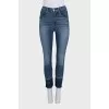 Blue jeans with fringe on the legs