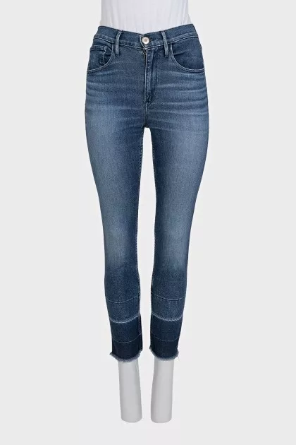 Blue jeans with fringe on the legs
