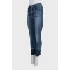 Blue jeans with fringe on the legs