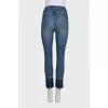 Blue jeans with fringe on the legs
