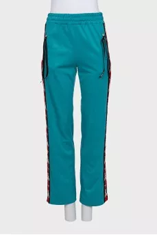 Green suit with signature print