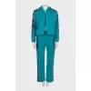 Green suit with signature print