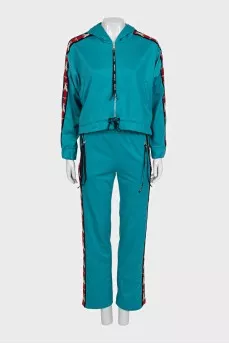 Green suit with signature print