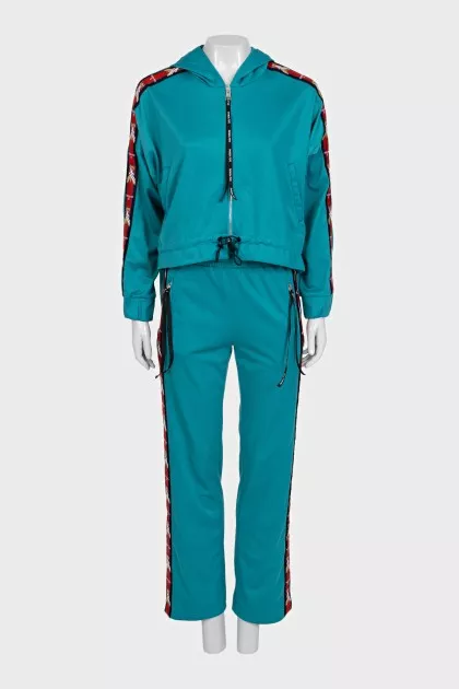 Green suit with signature print