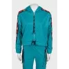 Green suit with signature print
