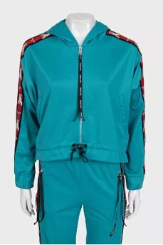 Green suit with signature print