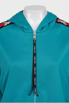 Green suit with signature print