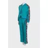 Green suit with signature print