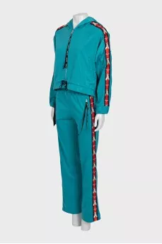 Green suit with signature print