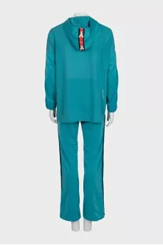 Green suit with signature print