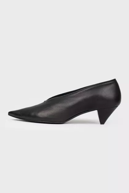 Black leather shoes with a sharp toe