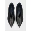 Black leather shoes with a sharp toe
