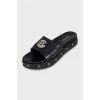 Leather flip-flops decorated with a gold logo