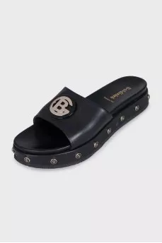 Leather flip-flops decorated with a gold logo
