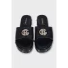 Leather flip-flops decorated with a gold logo
