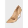 Beige leather pumps