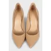 Beige leather pumps