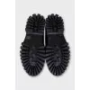 Black loafers with logo