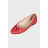 Quilted ballet flats decorated with a pendant