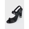 Black leather heeled sandals with silver hardware