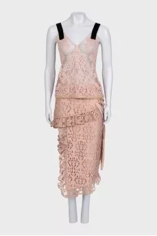 Lace suit with an asymmetrical skirt