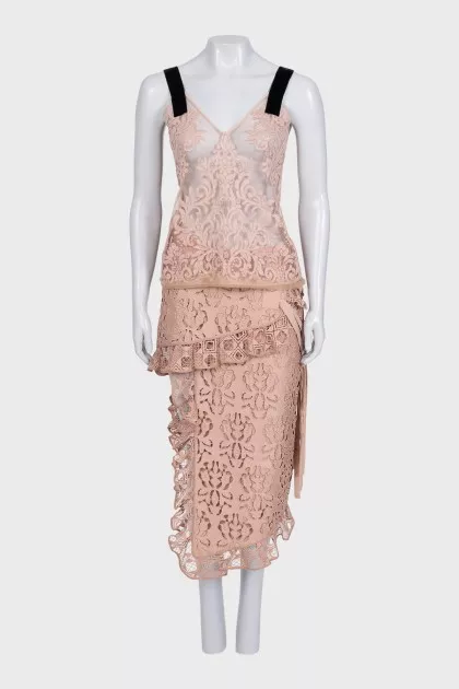 Lace suit with an asymmetrical skirt