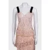Lace suit with an asymmetrical skirt