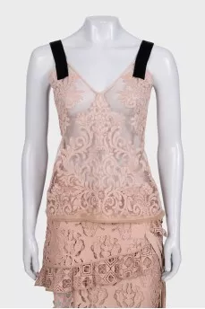 Lace suit with an asymmetrical skirt