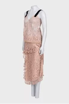 Lace suit with an asymmetrical skirt