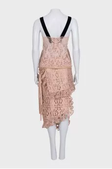 Lace suit with an asymmetrical skirt