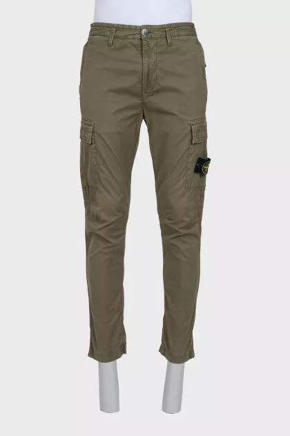 Men's green trousers with a branded patch