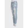 Men's ripped jeans with logo on the pocket