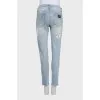 Men's ripped jeans with logo on the pocket