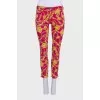 Pink cropped trousers with a print